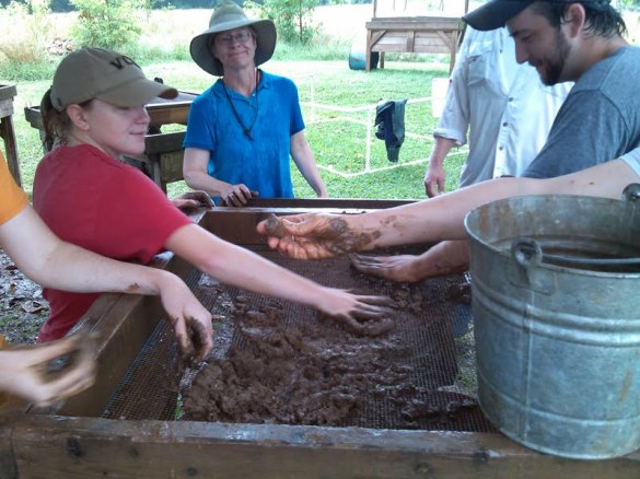  Laura (our field director), Ashley (TA/ field crew chief), Allen (field crew chief), and other interns help shifting some dirt/mud looking for artifacts. 