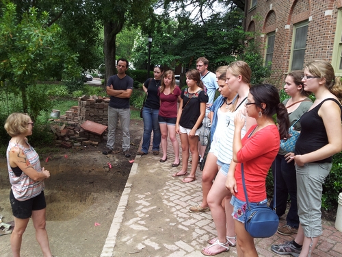 Crystal Castleberry, a legacy of the VCU archaeology field school (2012 edition) gives a tour of the Bray School site in Colonial Williamsburg.