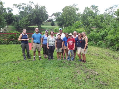 The field school poses with the Rappahanock River in the background.